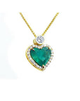 18k yellow gold heart pendant with a large bluish-green emerald haloed by diamonds on a delicate chain.
