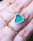 Sider Colombian emerald necklaces for sale in usa tilted heart shaped halo natural diamond handcrafted in 18k yellow