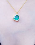 Tilted emerald heart necklace for sale heart shaped halo natural diamond handcrafted in 18k yellow