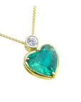 Heart-shaped emerald pendant with gold frame and diamond made of 18k yellow gold.