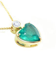 Gold necklace with a heart-shaped emerald pendant on a right-side profile, top and gallery profile view.