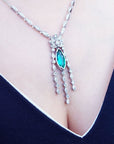 Natural ladies' marquise emerald necklaces from the Muzo mine Colombia, crafted by marquise's gold links in 14k white gold