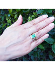 Emerald engagement ring, 2.86 ct. medium green emerald, 18K yellow gold, three rows of diamonds.