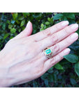 Emerald engagement ring, 2.86 ct. medium green emerald, 18K yellow gold, three rows of diamonds.