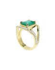 18K yellow gold engagement ring with a rectangular emerald and three rows of natural diamonds.
