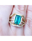Ladies' emerald May birthstone ring with genuine diamonds in 18k yellow gold.