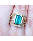 Ladies' emerald May birthstone ring with genuine diamonds in 18k yellow gold.
