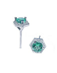 Pair of 14K white gold stud earrings with round green emeralds surrounded by tiny white gems in a hexagonal halo.