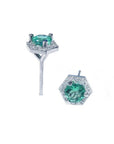 Pair of 14K white gold stud earrings with round green emeralds surrounded by tiny white gems in a hexagonal halo.
