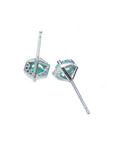 Pair of 14K white gold stud earrings with round cut emeralds in a hexagonal setting.