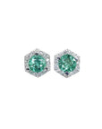 A pair of emerald stud earrings with small geometric halo diamond accents, set in 14K white gold.