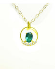 14k yellow gold necklace with oval Colombian emerald pendant and diamond accents.