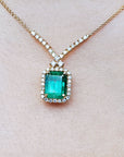 Colombian Muzo Emerald necklaces emerald-cut natural emerald deep green bluish color, encircled by a halo diamond high quality
