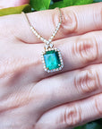 14K Yellow gold Emerald necklace emerald-cut natural deep green bluish color, encircled by a halo diamond high quality