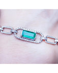 14k White and yellow gold paperclip bracelet with an emerald-cut natural colombian emerald and accent diamonds.