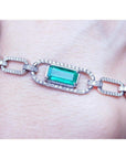 14k White and yellow gold paperclip bracelet with an emerald-cut natural colombian emerald and accent diamonds.