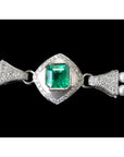 18K white gold emerald and pearl bracelet with diamond accents and a bezel-set Colombian emerald clasp.