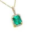 14k yellow gold necklace with a natural colombian emerald pendant with a halo diamond.