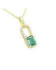 Gold necklace with a natural emerald-cut emerald pendant with a halo diamond, top and side profile visibles.