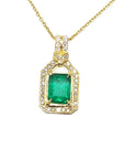 A 18k yellow gold natural emerald pendant, the square center gemstone is surrounded by natural diamonds, topside view.