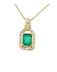 A 18k yellow gold natural emerald pendant, the square center gemstone is surrounded by natural diamonds, topside view.