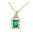 18K yellow gold emerald pendant with natural diamonds, prong set, on a delicate chain.