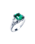 This emerald platinum ring for ladies is displaying the right-side profile.