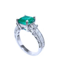 1.62 ct. square emerald ring with princess cut diamonds on a 14K white gold band.