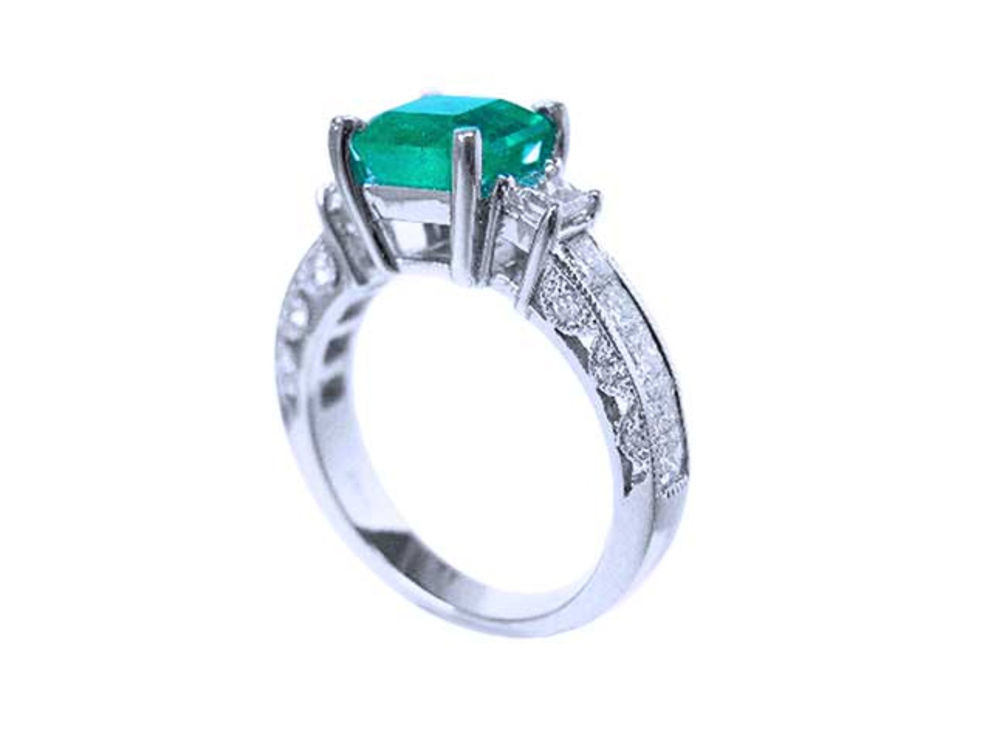An emerald-cut real Colombian emerald ring on a half side positon, top and band profile visibles.