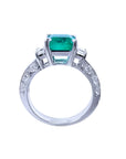 1.62 ct. square emerald ring with princess cut diamonds on a 14K white gold band.