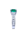 1.62 ct. square emerald ring with princess cut diamonds on a 14K white gold band.