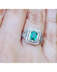 Emerald ring with double halo of natural diamonds and matching band 14k white gold.