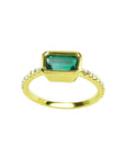 14K yellow gold east-west emerald ring, bezel set rectangular emerald, diamond accents.