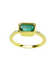 14K yellow gold east-west emerald ring, bezel set rectangular emerald, diamond accents.