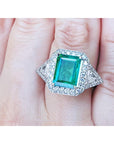 A GIA certified natural Colombian emerald ring for women 18k white gold on a woman's hand.