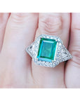 A GIA certified natural Colombian emerald ring for women 18k white gold on a woman's hand.