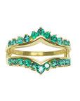 A yellow gold emerald ring guard to insert a solitaire engagement ring frontal view.
