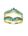 A high profile of an emerald ring guard topside view.