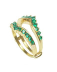 A yellow gold emerald enhancer ring displaying its half side perspective position.
