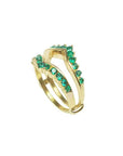 A yellow gold emerald enhancer ring displaying its half side perspective position.
