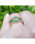 0.75 ct. emerald ring guard in 14K yellow gold, featuring two curved bands of brilliant green emeralds.