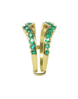 The side profile of a yellow gold emerald enhancer ring.