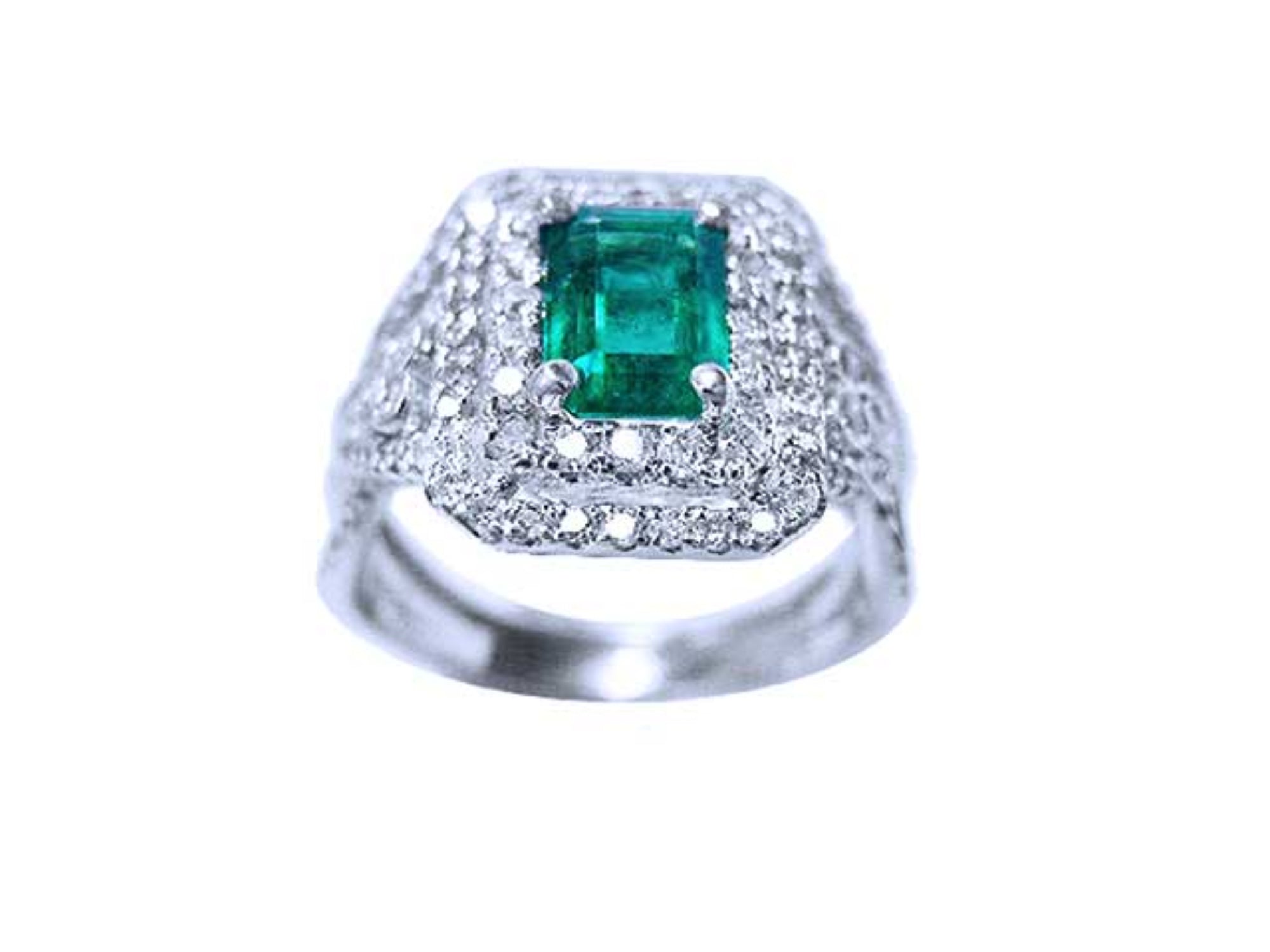 An emerald-cut colombian emerald encircled in double halo diamond ring in white gold.