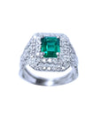 1.01 carat emerald ring with double halo diamonds and matching band in 14K white gold.
