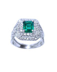 1.01 carat emerald ring with double halo diamonds and matching band in 14K white gold.