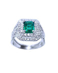 1.01 carat emerald ring with double halo diamonds and matching band in 14K white gold.