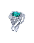 1.01 carat emerald ring with double halo diamonds and matching band in 14K white gold.