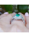 1.01 carat emerald ring with double halo diamonds and matching band in 14K white gold.