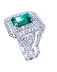 A Muzo born real colombian emerald with halo diamond ring top and side profile view