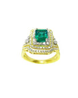 This Colombian emerald and match band ring has a double halo of natural diamonds, top and side profile visibles.
